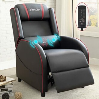 Black and red gaming recliner chair with remote control in a room