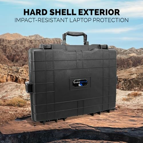 Hard shell laptop case in rugged outdoor setting.