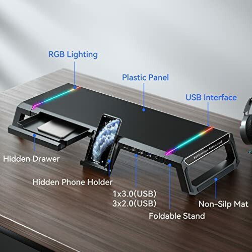 Multifunctional monitor stand with RGB lighting, USB ports, hidden drawer, and phone holder.