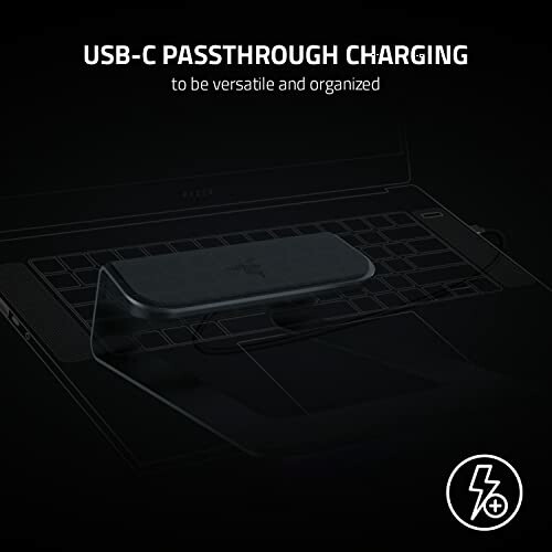 USB-C passthrough charging device on laptop.